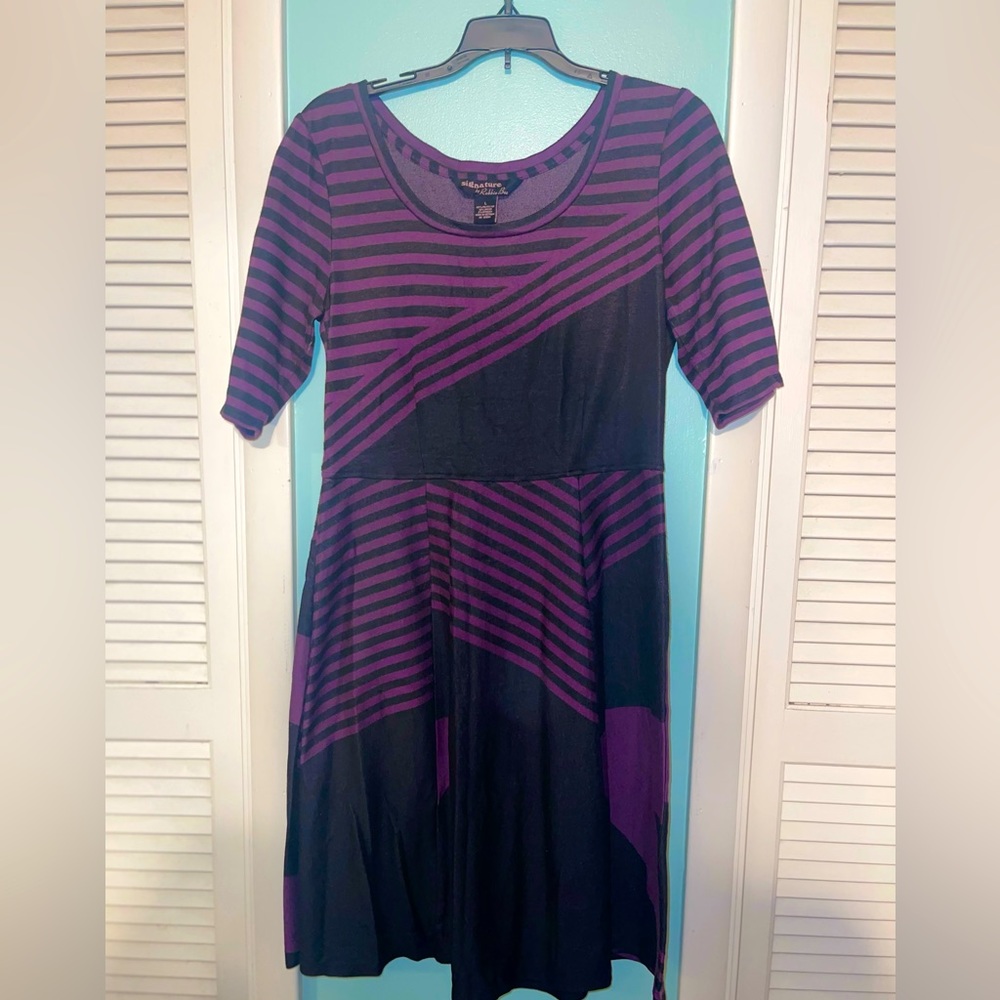 Beautiful, gently used purple and black dress, size large. Barely worn.